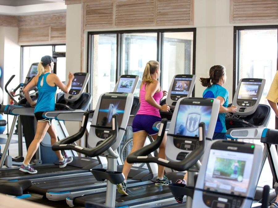 People running on treadmills in the fitness centre 