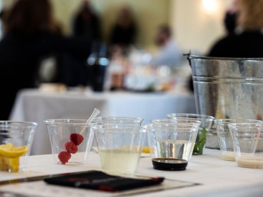 Ingredients for a cocktail in separate cups for a mixology class.