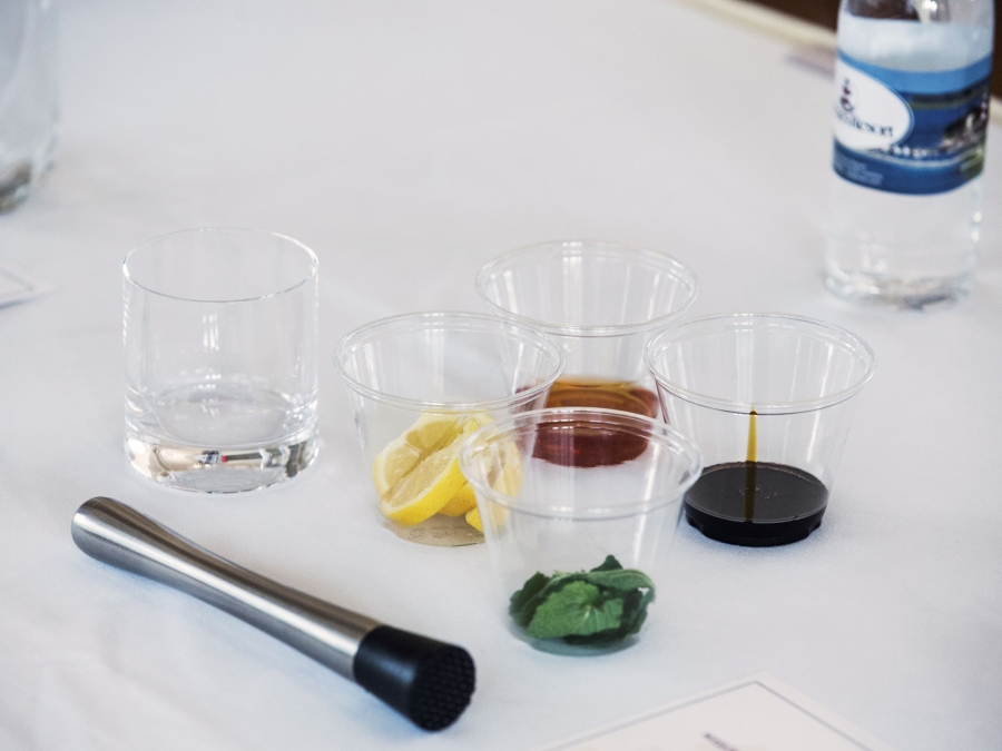 Ingredients for a cocktail in separate cups for a mixology class.
