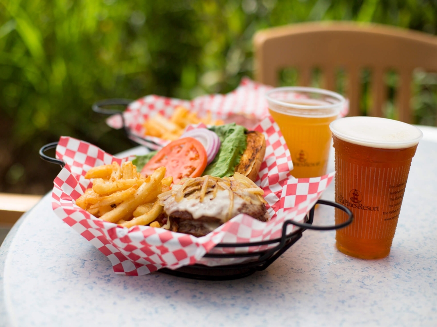 Photo of a burger, fries, and beer
