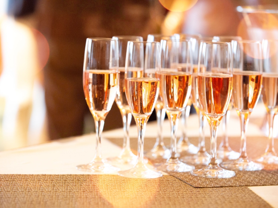 A group of champagne glasses on a table.