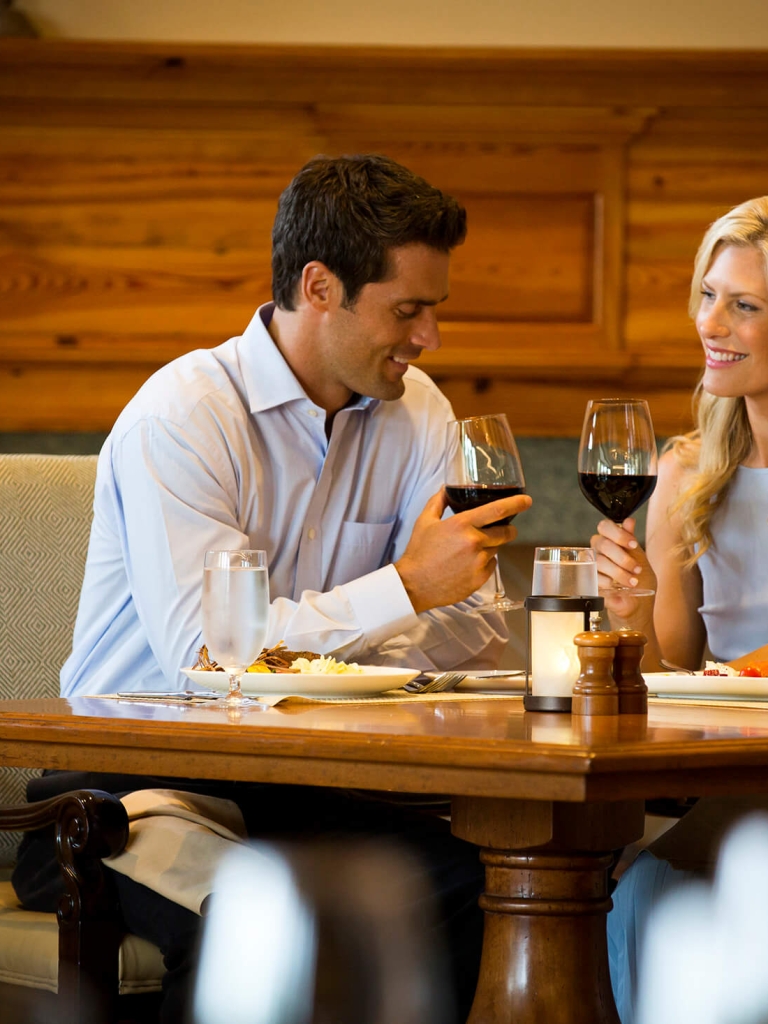 A couple cheer-sing wine glasses 