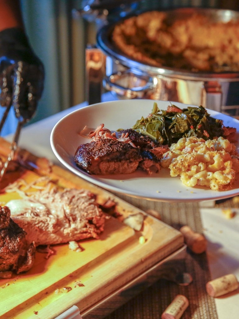 A person being served some roast meat 