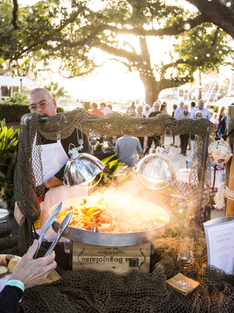 People gathering around a shrimp boil 