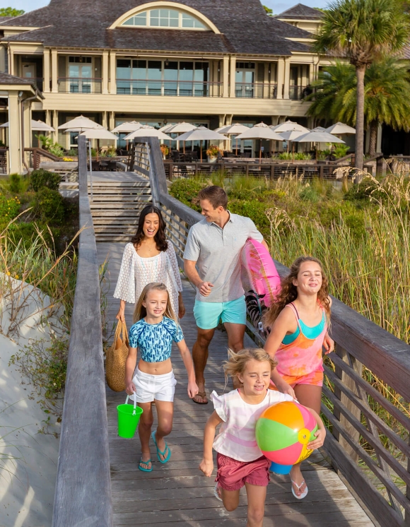 Family walking on a boardwalk 