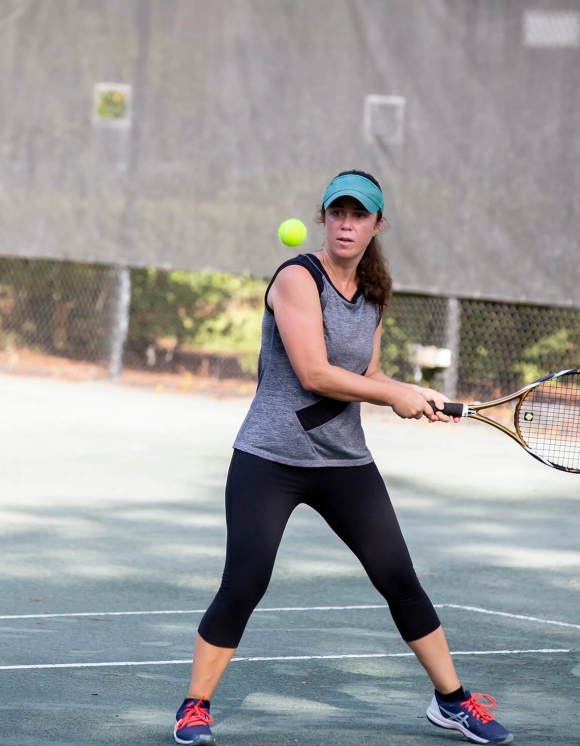 Adult women playing tennis 