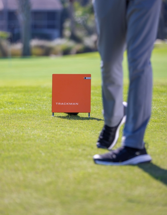 A golfer's shoes with the Trackman technology on the greens. 