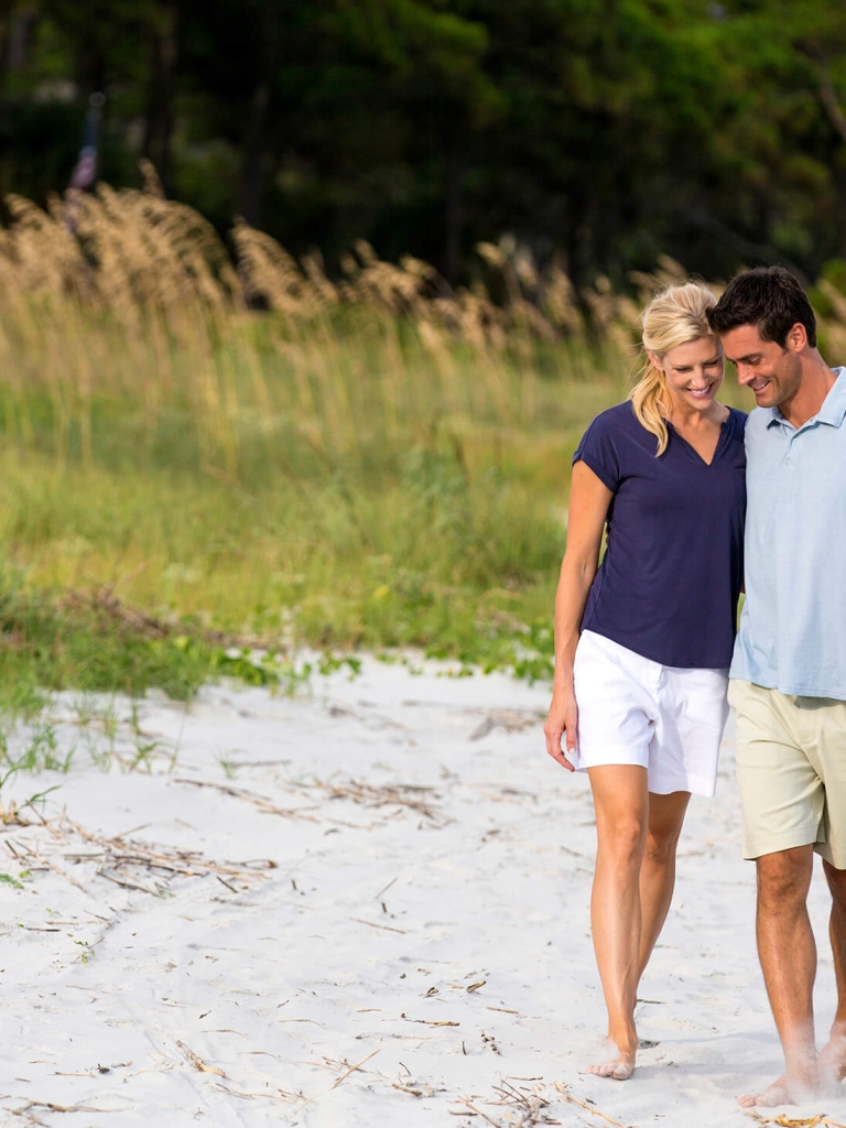 A couple walking on the beach 