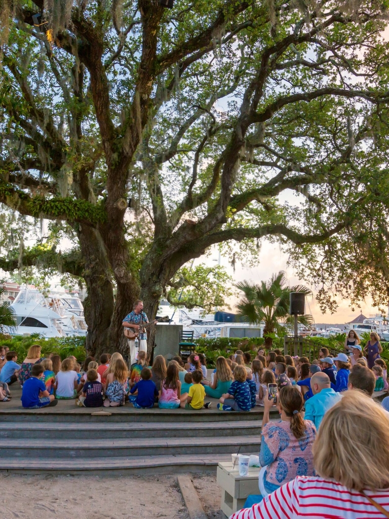 People gathering at a Gregg Russel concert 