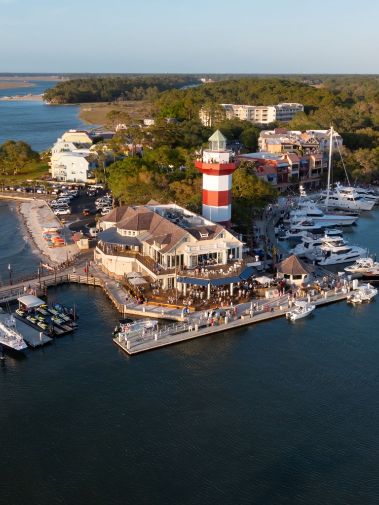 Aerial image of the Harbour Town Lighthouse and Quarterdeck and the Harbour Town Yacht Basin