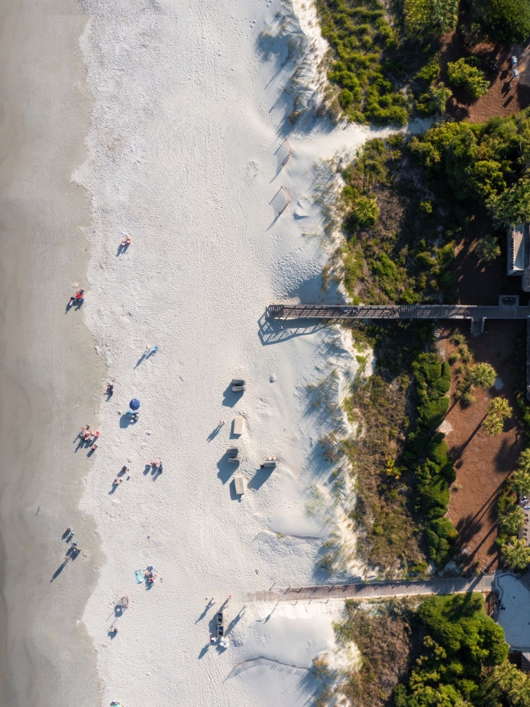 An aerial photo of the Sea Pines Beach Club with the Beach Club on the right and the ocean on the left