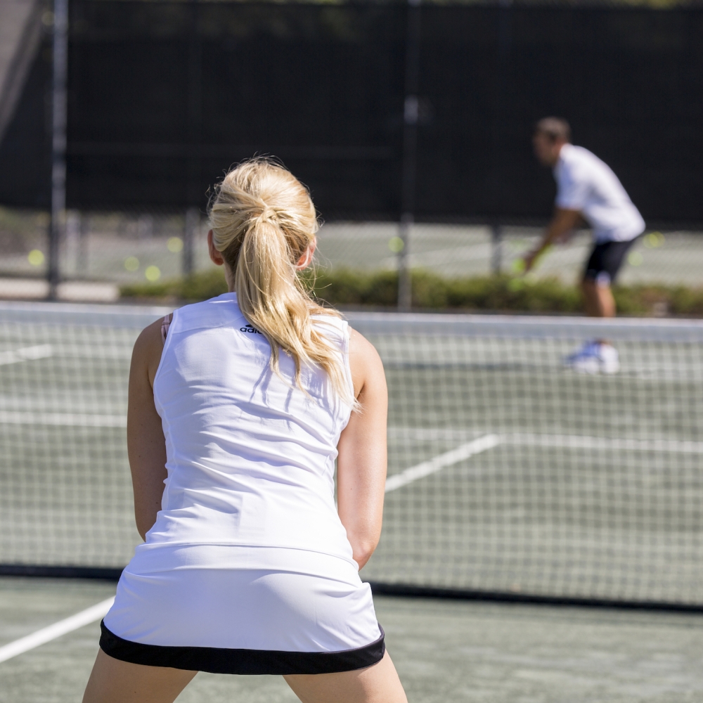 Man and women playing tennis 