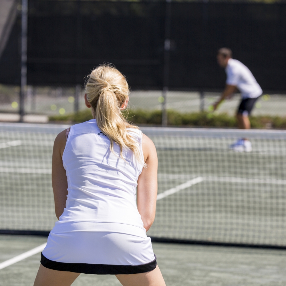 Man and women playing tennis
