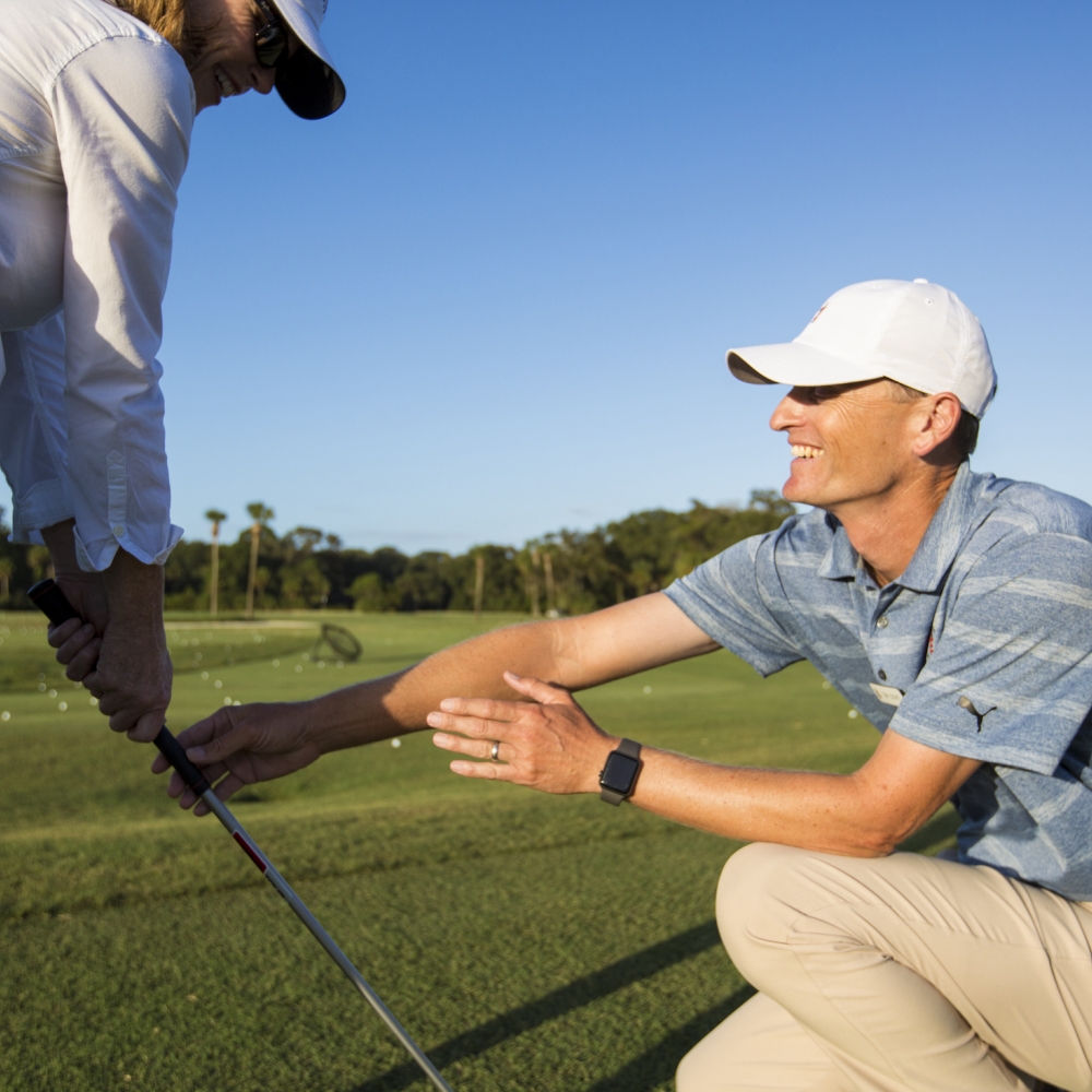 Tim Cooke coaching a women 