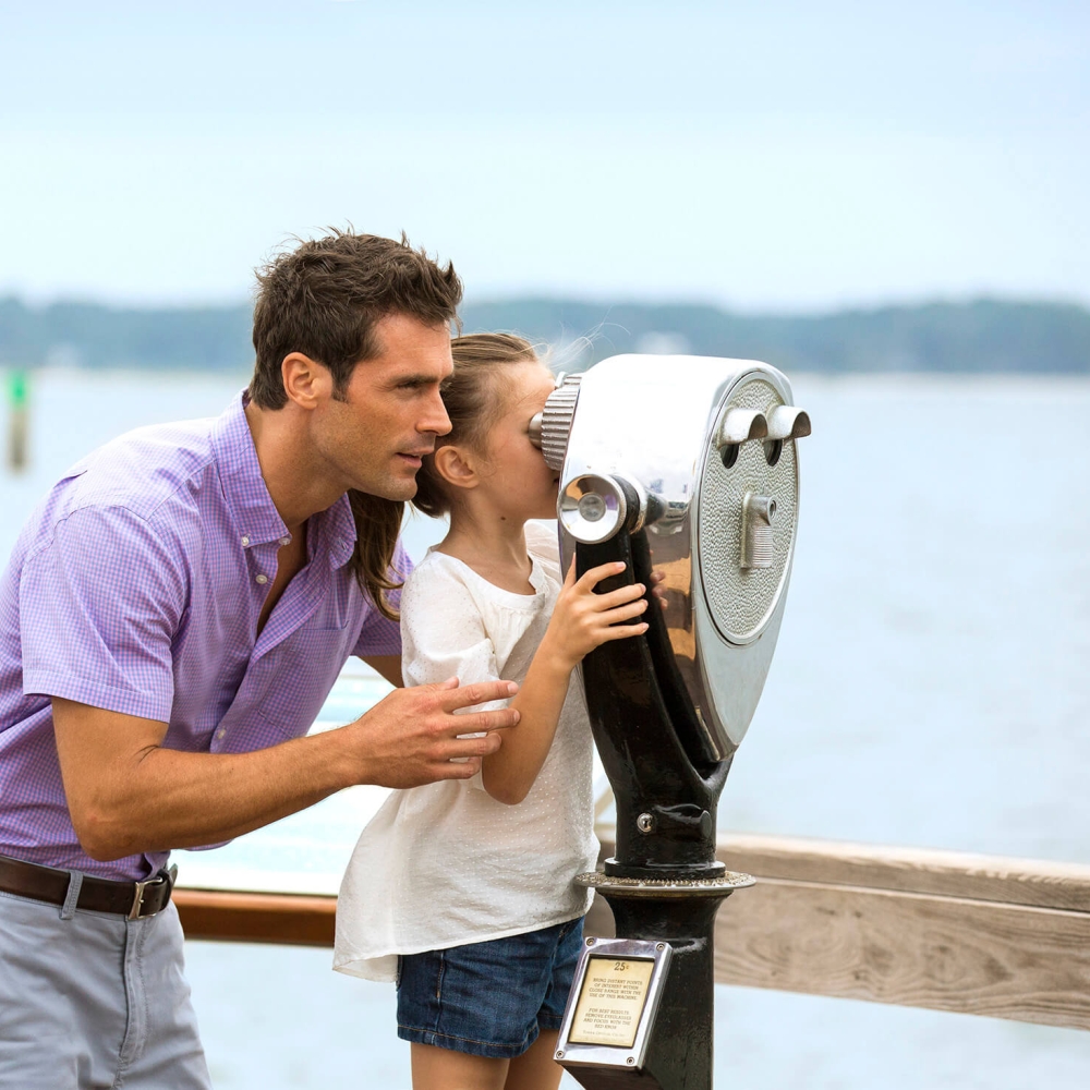 Father and daughter at a lookout  