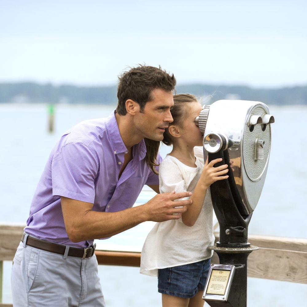 Girl looking through binoculars