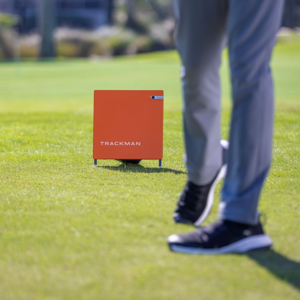 A golfer's shoes with the Trackman technology on the greens. 